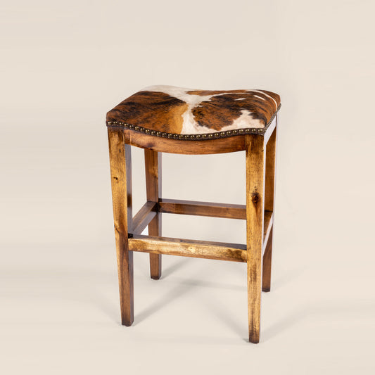 Platzer Saddle Stool in white and brown cowhide leather – side view